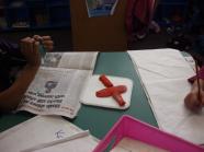 A play-dough cross.