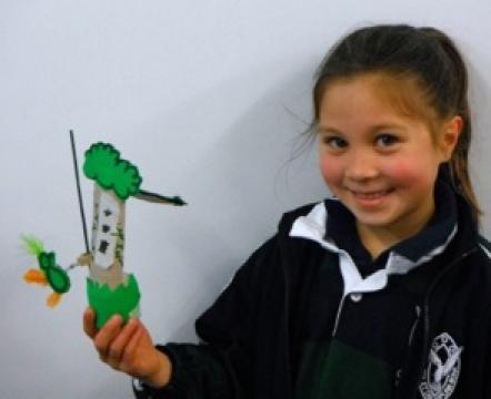 Student demonstrating her toy.