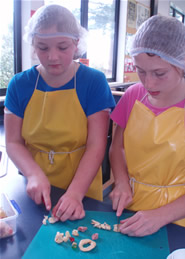 Students preparing ingredients. Students preparing ingredients.