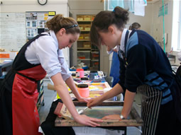 Students screen printing.