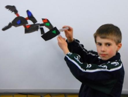 Student demonstrating his toy.
