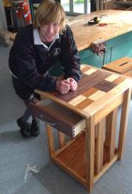 A student showing his coffee table