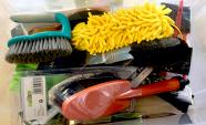 A bin of brushes made of different materials
