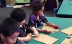 Students making cardboard models of the shade houses