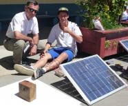 A student testing his Solar PV water heating system