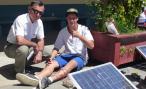 A student testing his Solar PV water heating system